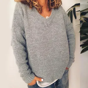 Grey V-neck knitted sweater detail, loose casual pullover top for women, cozy winter wear.