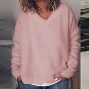 Detailed view of women pink V-neck knitted sweater, soft textured fabric and loose fit.