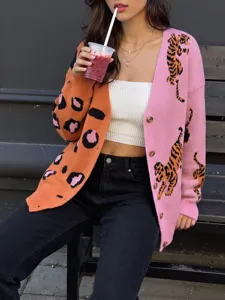 Color-blocked knit cardigan detail featuring orange leopard and pink tiger patterns.