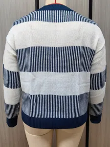 Detail view of women's blue and white striped knit sweater, casual autumn long sleeve top.