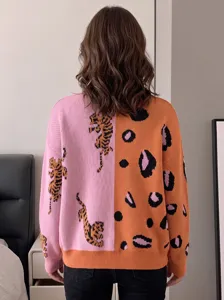 Detail view of color-blocked knit cardigan featuring split tiger and leopard jacquard patterns.