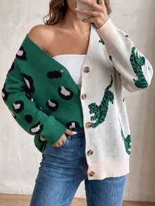 Close-up detail of colorblock knitted cardigan featuring leopard and animal print patterns.