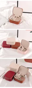 Detail view of multi-color portable mini jewelry boxes with soft lining and zipper
