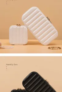 Detailed view of striped PU leather jewelry boxes in elegant black and white colors