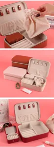 Detail view showing internal compartments of the vintage leather jewelry organizer set.