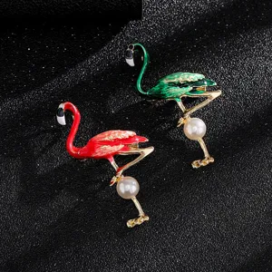 Detailed macro view of elegant flamingo brooches with enamel finish and pearl
