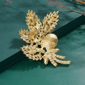 Back view detail of the vintage gold maple leaf brooch showing the secure pin clasp.