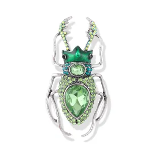 Vintage insect beetle brooch with green crystals and enamel for clothes