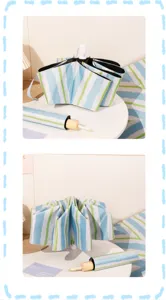 Detailed view of the blue and green striped folding umbrella with wood texture handle