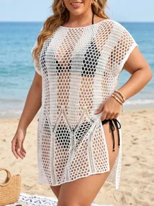 Detailed macro view of white crochet beach cover-up featuring intricate knit pattern