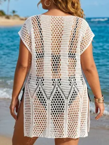 Back view of a white plus size crochet beach dress cover-up with intricate patterns