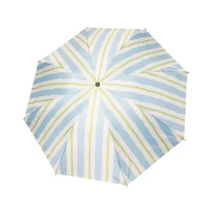 Blue and lime green striped sun umbrella with UV protection and compact portable design
