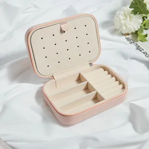 Elegant pink portable travel jewelry organizer box with earring plate and ring slots