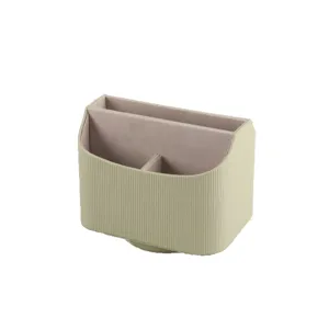Sage green rotating desktop organizer with ribbed texture and three compartments