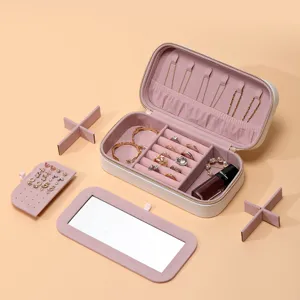 Portable white jewelry box with pink velvet interior, mirror, and multi-functional storage