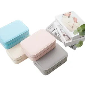 Portable PU leather jewelry storage boxes in multiple colors for earrings and rings.