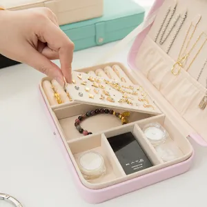 Portable pink leather jewelry box organizer with earring board and snap closure
