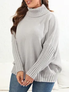 Detailed view of cozy light grey knit turtleneck sweater, soft texture, casual fit.