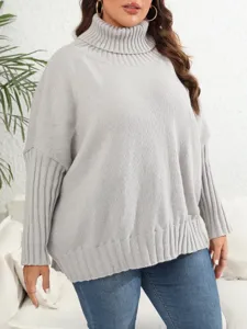 Close-up detail of cozy grey turtleneck knit sweater, soft texture and comfortable fit.