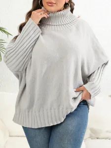 Detail view of a cozy plus-size grey turtleneck knitted sweater, soft and warm pullover.