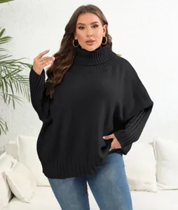 Detailed view of the black turtleneck knit sweater with long sleeves and cozy relaxed fit.