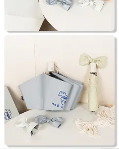 Close-up view of cute cartoon automatic folding umbrellas with decorative bow-tie accessories