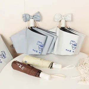 Automatic folding umbrella with cartoon dog design and bow handle decoration