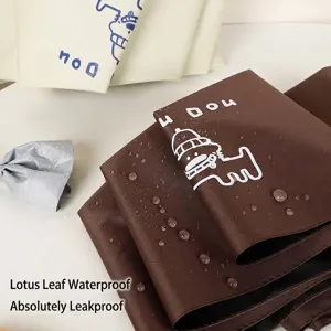 Brown automatic umbrella fabric detail with waterproof coating and cartoon dog logo