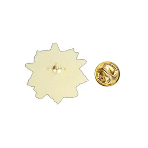 Detailed back view of the metal brooch pin featuring the needle and golden butterfly clutch