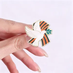 Detailed view of white Peace Dove enamel pin with St. George's ribbon for Victory Day.