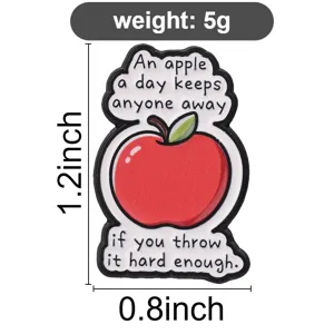 Detail view of a funny red apple enamel pin badge with 1.2 and 0.8 inch size markings
