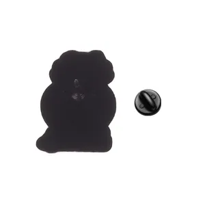 Detailed back view of metal apple brooch with a black rubber clutch fastener.