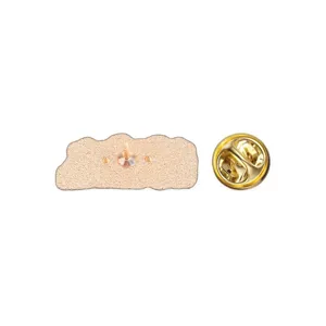 Detailed view of gold metal enamel pin back featuring a secure butterfly clutch fastener.