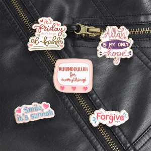 Set of five Islamic motivational enamel pins with English quotes on leather jacket