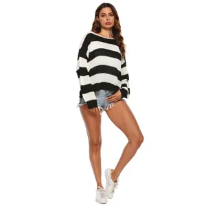 Detailed view of the black and white striped knit sweater, casual and comfortable fabric style.