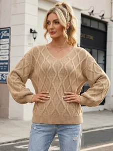 Detail view of casual V-neck cable knit sweater in chic beige, perfect for everyday wear.