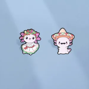 Cute Mexican style axolotl enamel pins featuring sombrero and traditional floral dress