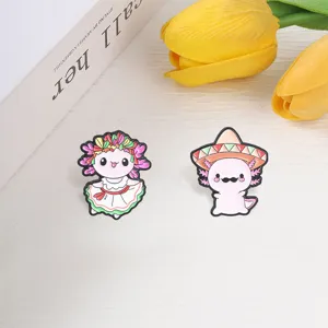 Close-up of Mexican style Axolotl enamel pins featuring sombrero and floral dress