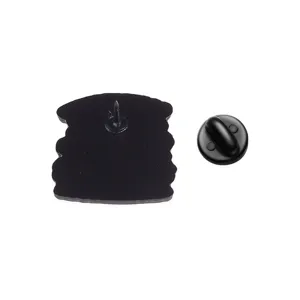 Detailed back view of the metal enamel pin with needle and black rubber clutch.