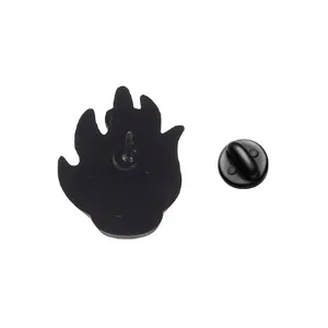 Rear view detail of black flame-shaped metal enamel pin with secure clutch