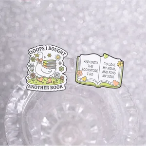 Detailed view of book lover enamel pins featuring a cute duck and inspirational quotes