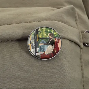 Close-up of a round metal badge pin featuring a girl on a bus illustration