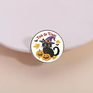 Round Halloween black cat metal brooch pin featuring Trick or Treat festive design