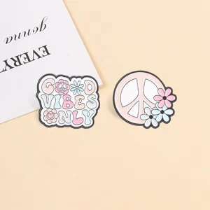 Set of two retro pink hippie peace sign and daisy flower enamel pins for backpack