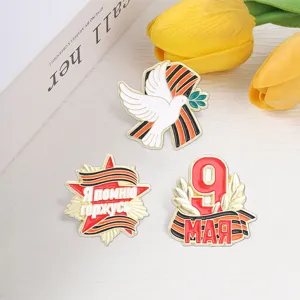 Set of three Soviet Victory Day commemorative enamel pins with dove and red star designs