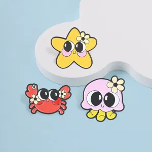 Set of cute cartoon marine animal enamel pins featuring starfish crab and octopus