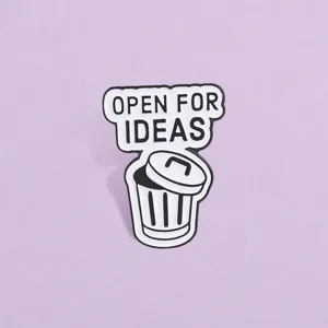 Close-up of funny Open For Ideas trash can metal enamel pin badge for backpack decor