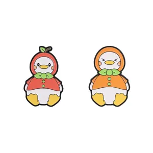 Set of cute cartoon fruit duck enamel pins featuring apple and orange themed designs