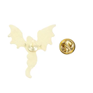 Detailed back view of a golden dragon-shaped metal brooch with a secure butterfly clutch