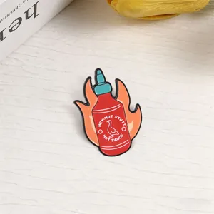 Creative enamel pin shaped like a hot sauce bottle with flames for jacket decor